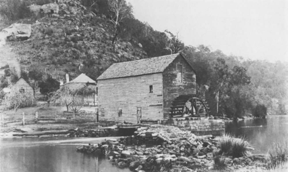 A photograph of Singletons Flour Mill and the miller's house at Layburys Creek, Wisemans Ferry NSW.