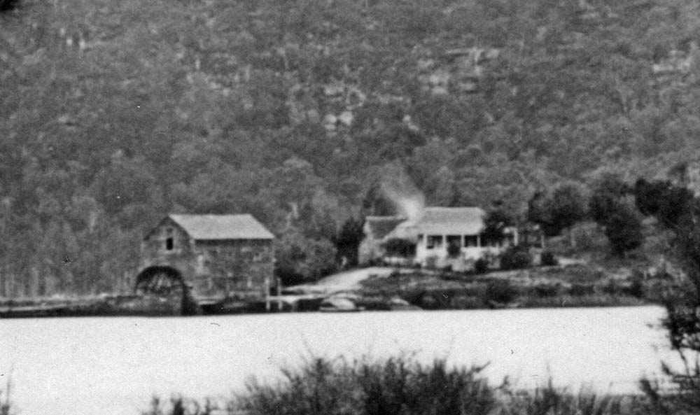 A rare photograph in the Dharug and Lower Hawkesbury Historical Society collection of Singletons  Mill at Laybury Creek, Wisemans Ferry NSW, taken from across the Hawkesbury River 