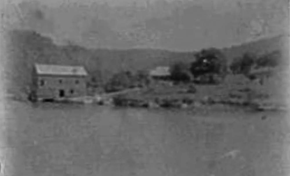 A photograph of Singletons  Mill at Laybury Creek, Wisemans Ferry NSW, from a newspaper cutting collection by G. B. Barton